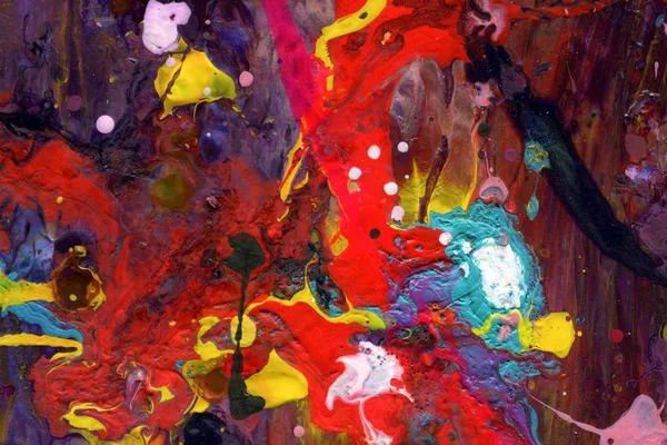 A colorful mix of organic shapes and vibrant paints creating a visually striking abstract image.