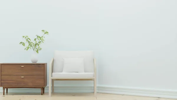 Soggiorno minimalista con poltrona bianca, tavolino in legno e pianta