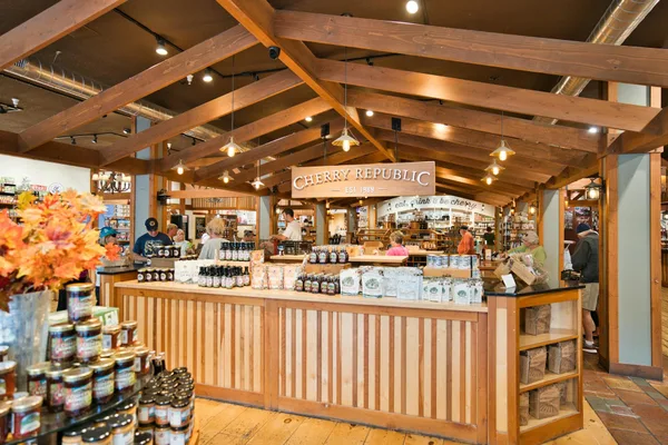 Warm interior shot of the Cherry Republic store showcasing wood decor and products.