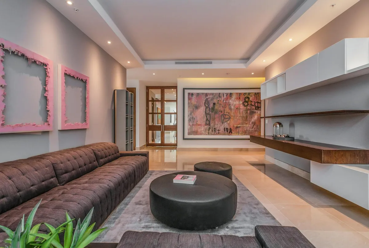 Stylish modern living room featuring minimalist design and contemporary art.