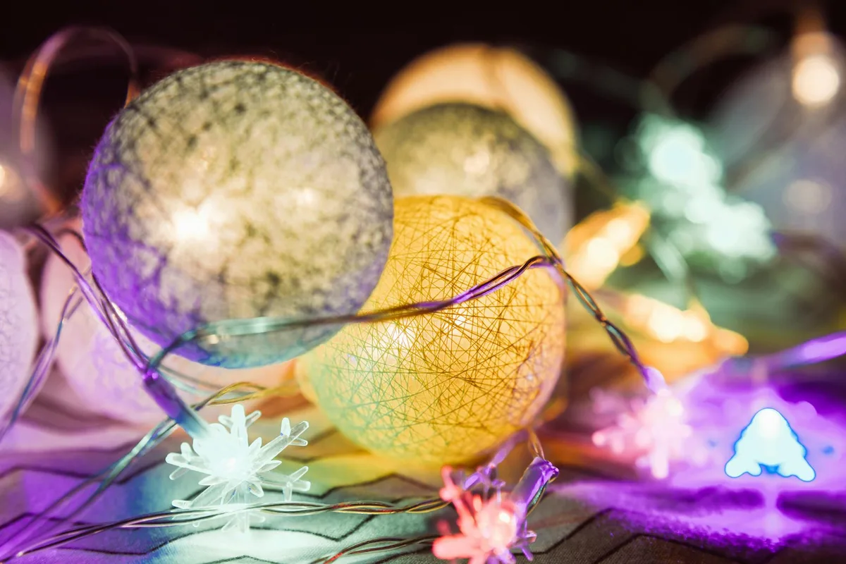 Colorful illuminated Christmas balls and decorations capture the festive spirit.