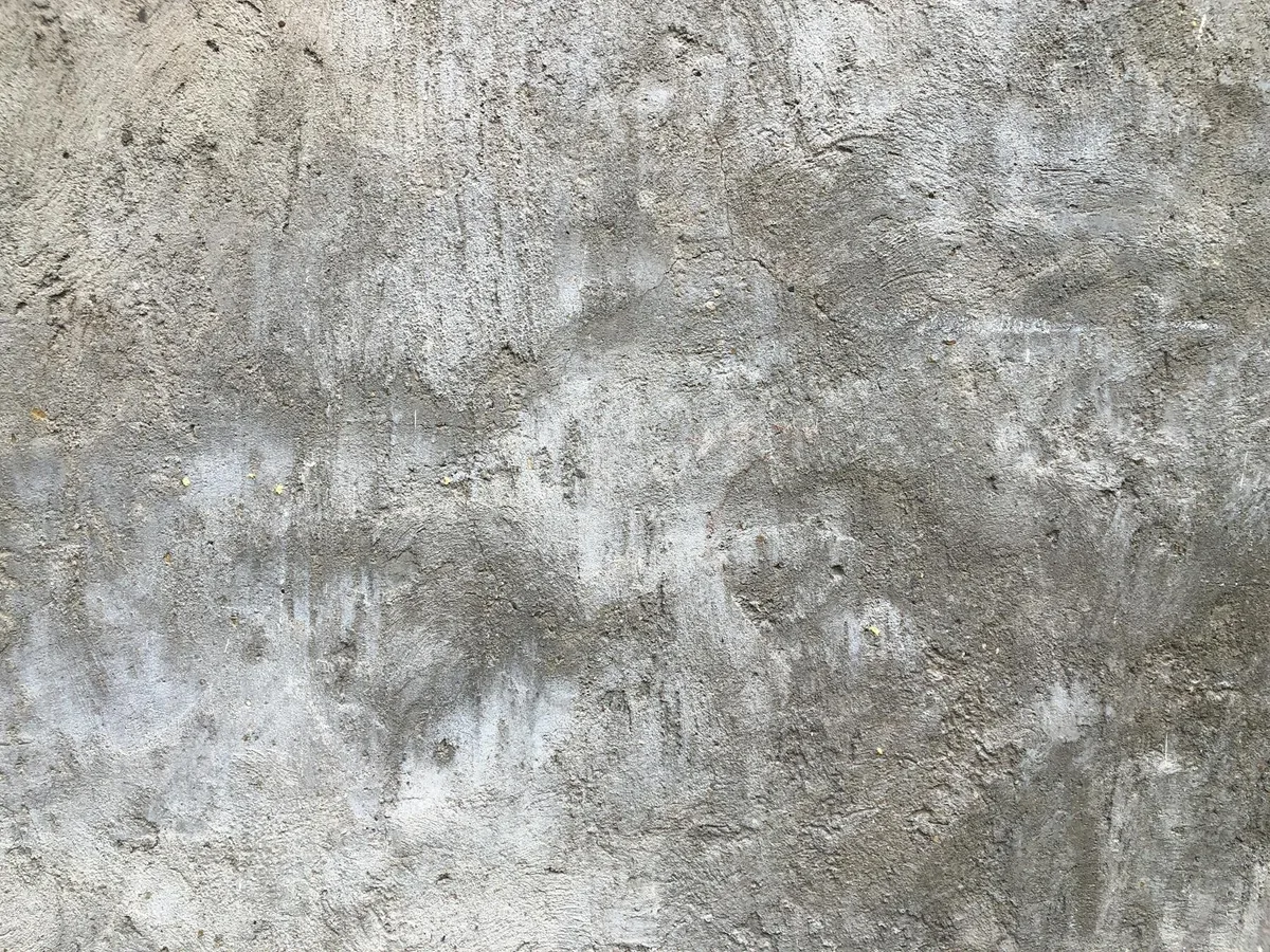 Primo piano di muro in cemento grigio strutturato per sfondi e design