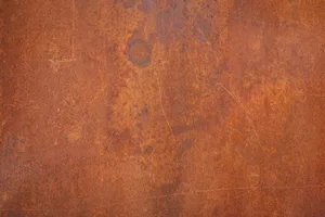 Close-up of a textured rusty metal surface, ideal for backgrounds or grunge design.