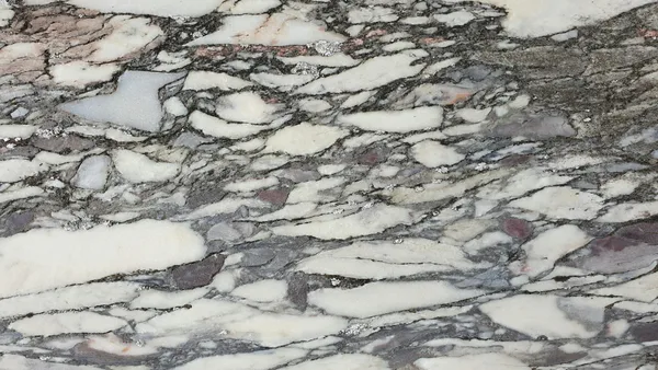 Immagine dettagliata marmo screpolato con crepe e colori naturali