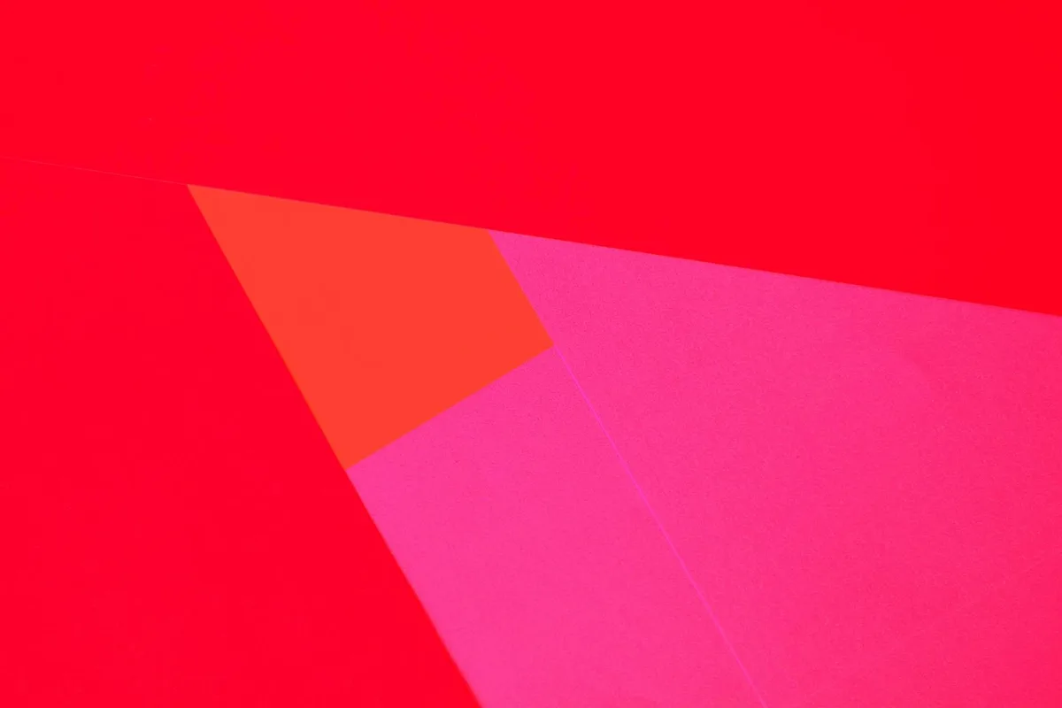 Bright abstract art with vibrant geometric shapes on colored paper.