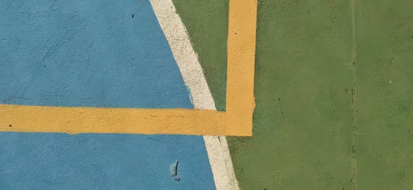 Close-up of a colorful sports ground with abstract lines and vivid colors.
