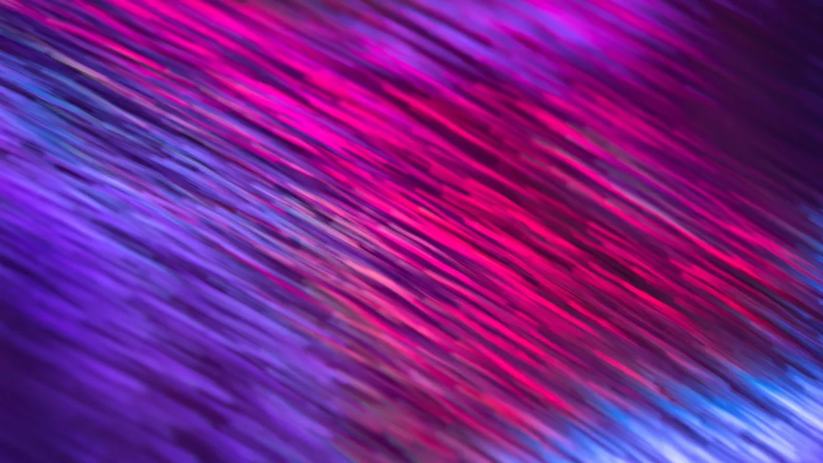 Strisce di luce rosa e viola dinamiche che creano uno sfondo astratto vibrante.