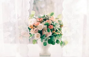 A beautiful bouquet of pastel flowers in a vase, perfect for elegant home decor.
